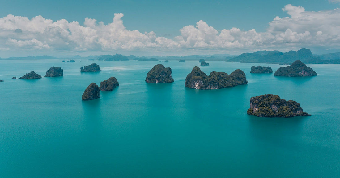 Aerial view of limestone karst islands in turquoise waters, Thailand
