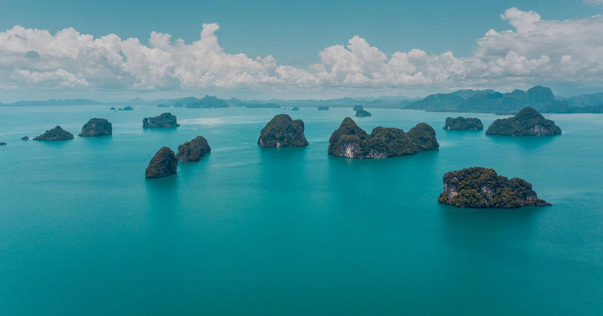 Aerial view of limestone karst islands in turquoise waters, Thailand