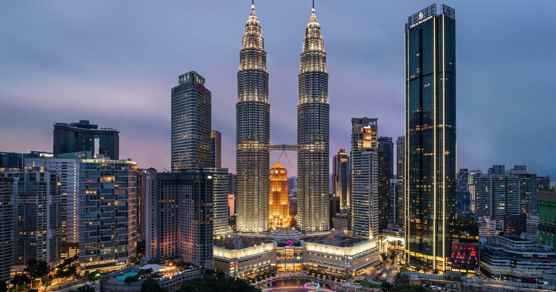 Kuala Lumpur skyline at dusk with the Petronas Twin Towers illuminated, Malaysia