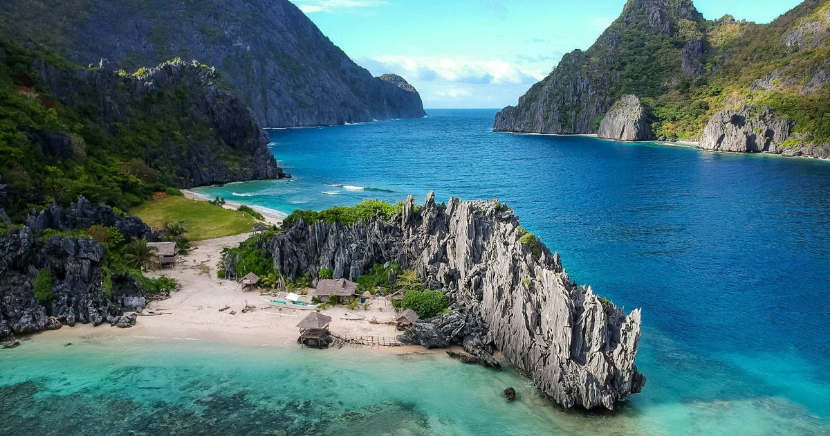Aerial view of the turquoise lagoon and limestone karst formations in Palawan, Philippines