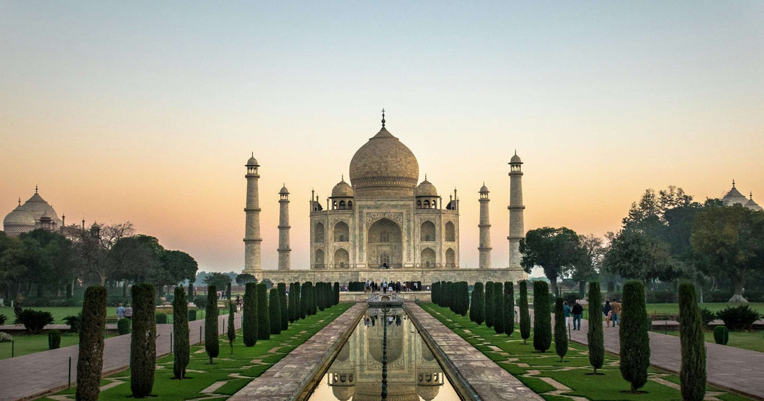 Taj Mahal at dawn with reflection pool and cypress gardens, Agra India
