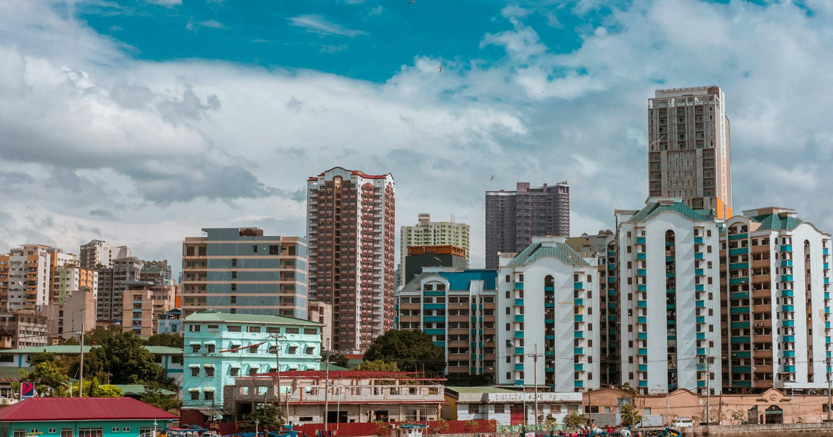 Manila waterfront skyline with colorful buildings and boats in the Philippines