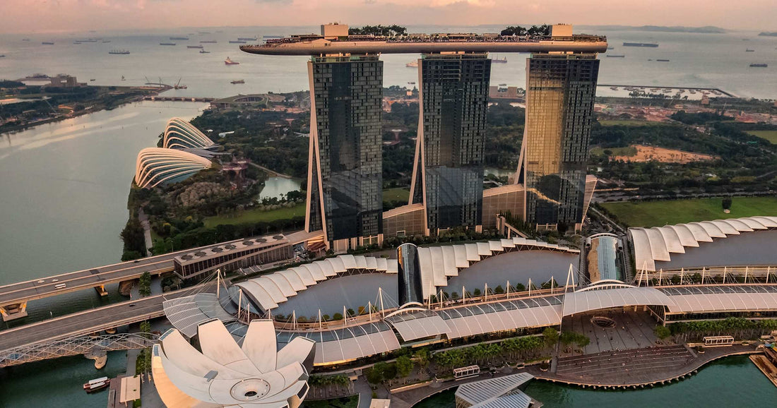 Marina Bay Sands and Singapore CBD skyline at golden hour aerial view