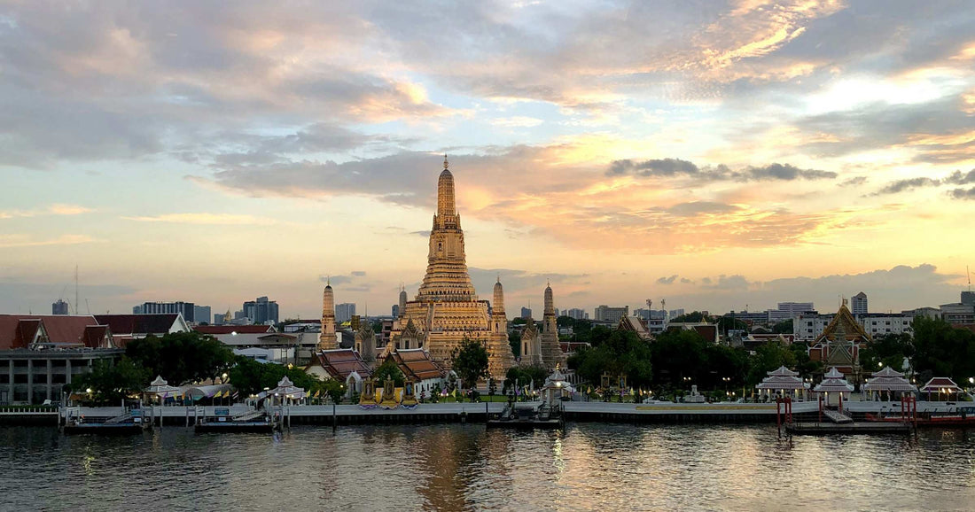 Wat Arun temple in Bangkok at sunset, starting point for the Thailand to Cambodia overland journey